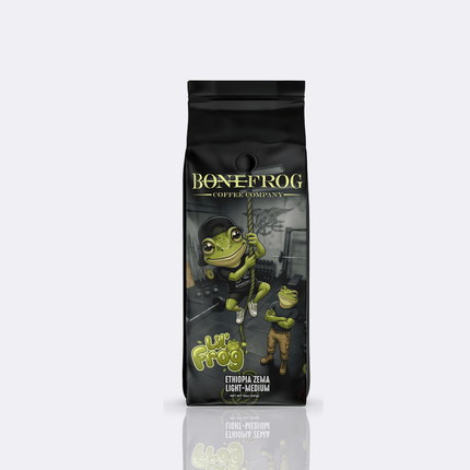 Lil Frog Coffee - Ethiopian Coffee - A black stand-up coffee bag from Bonefrog Coffee Company featuring a cartoon green frog illustration and the text 'Flip Flop' on a light gray background with a reflection below.